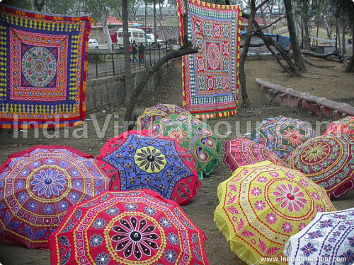Colorful embroidered umbrellas and wall hangings
