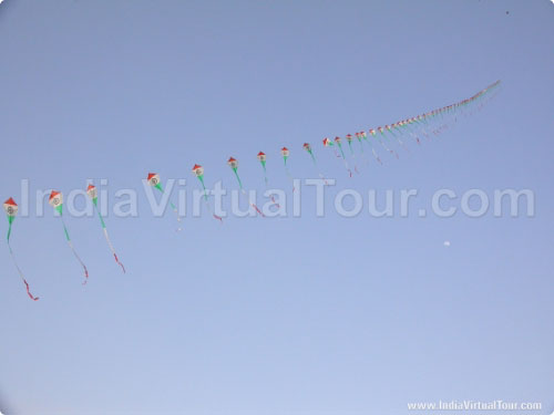 A row of kites in the colors of flag of India
