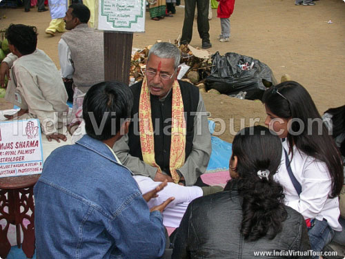 Astrologer telling about future to visitors