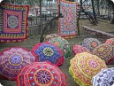 Colorful embroidered umbrellas and wall hangings